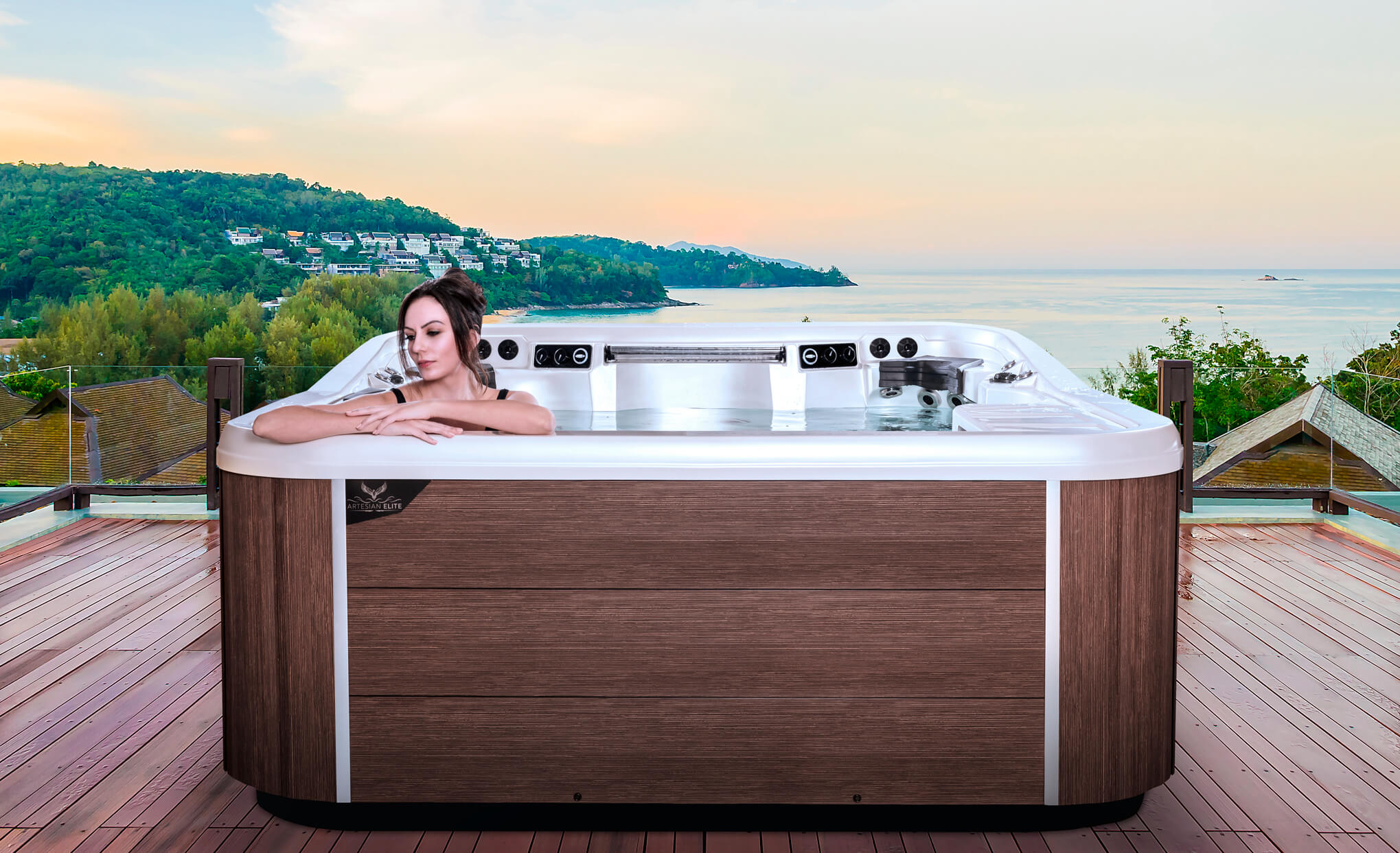 Hot tub steaming on a landscaped patio on a cool autumn evening